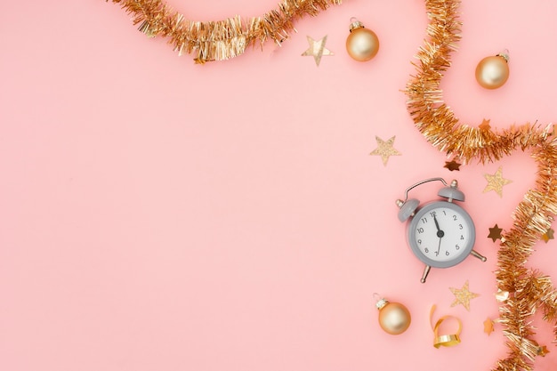 Alarm clock and festive party decoration with copy space