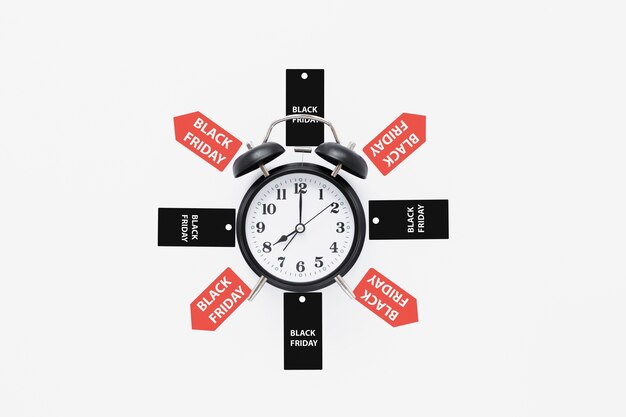 Alarm clock surrounded by black friday tags