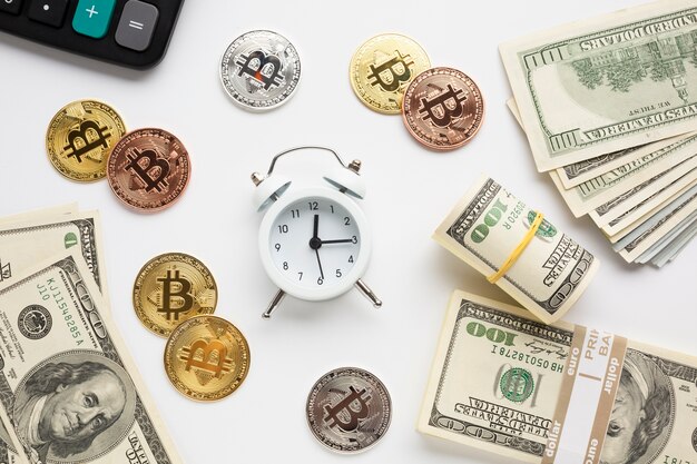 Alarm clock surrounded by currency