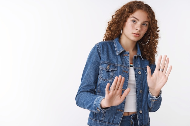 Alarmed intense displeased serious-looking worried cute redhead girl curly hair freckles acne step back disturbed raise palms defensive sorry look reluctant carefully refusing, give rejection