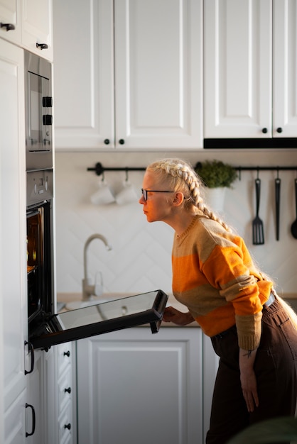 Albino person doing home activities