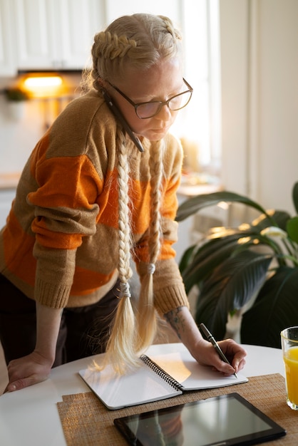 Albino person at home doing activities