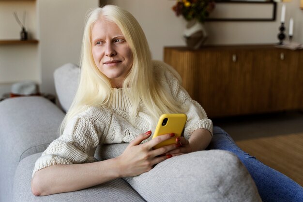 Albino woman doing indoor activities