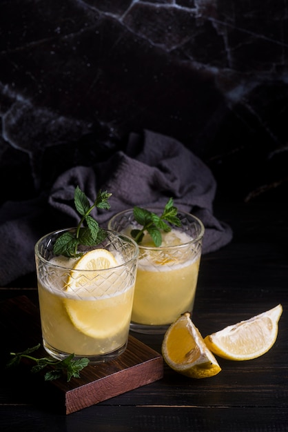 Free photo alcoholic beverage cocktail with lemon luxury background