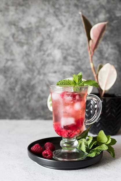 Alcoholic beverage cocktail with raspberry