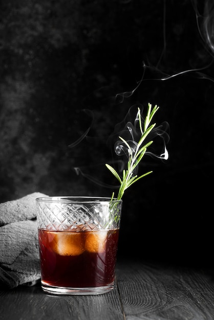 Alcoholic beverage cocktail with smoke
