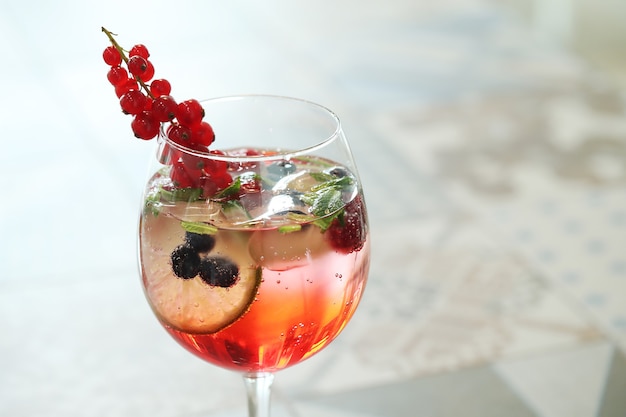 Alcoholic cocktail with fruits