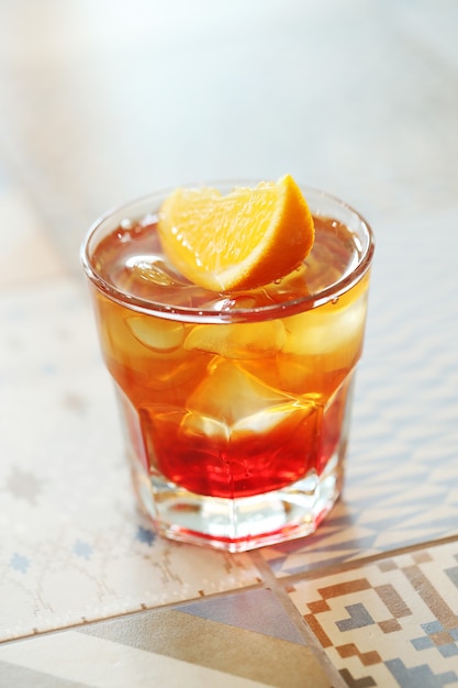 Alcoholic cocktail with orange slices