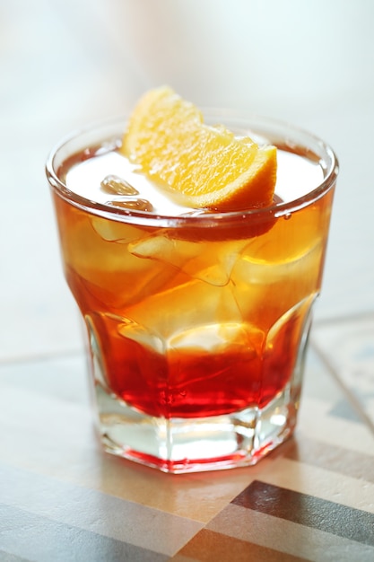 Alcoholic cocktail with orange slices