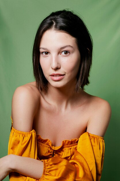 Alluring woman posing in yellow top