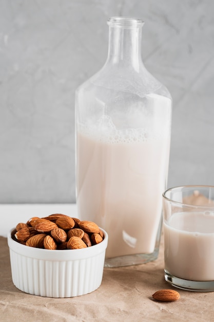 Free photo almond milk in bottle and glass