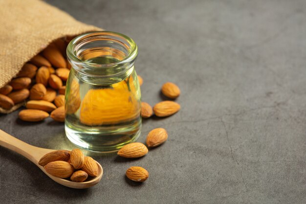 Almond oil in bottle on dark background