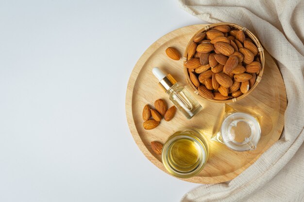 Almond oil in bottle on white background