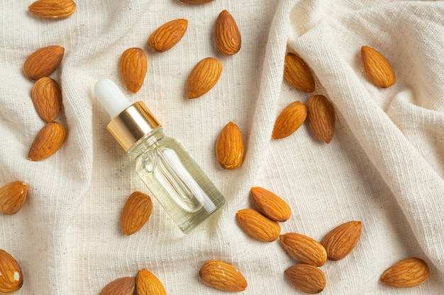 Almond oil in bottle on white background