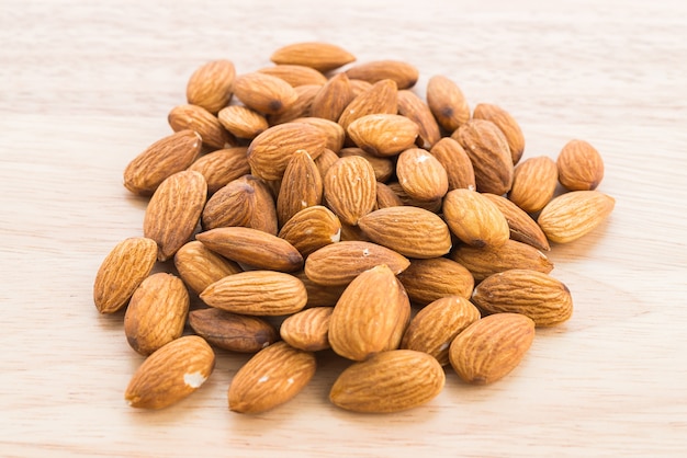 Almond on wooden background