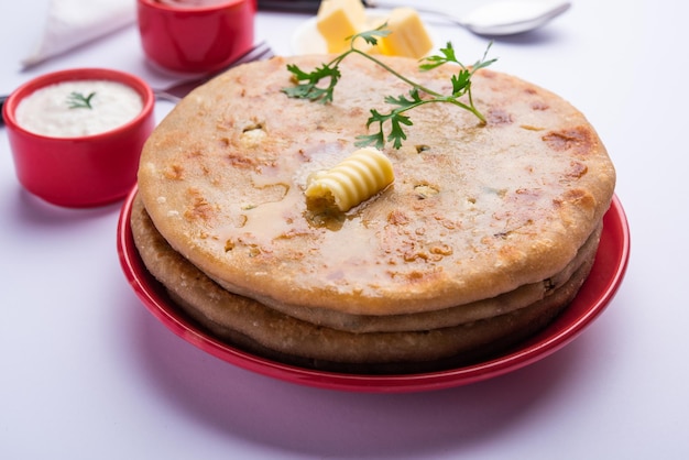 Aloo paratha or gobi paratha also known as potato or cauliflower stuffed flatbread dish originating from the indian subcontinent