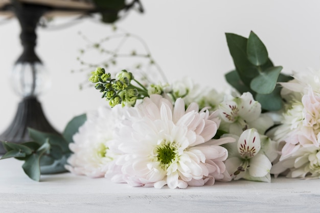 Alstromeria and chrysanthemum flowers against white background