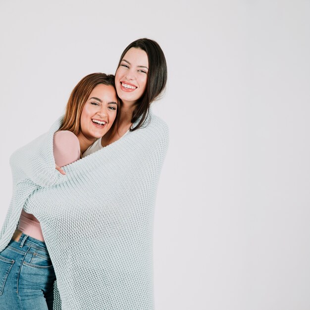 Alternative female couple in blanket