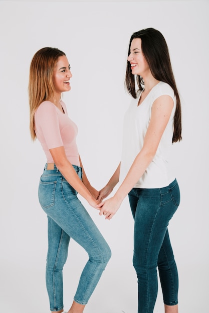 Alternative female couple holding hands