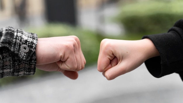 Free photo alternative greetings almost touching fist bumps