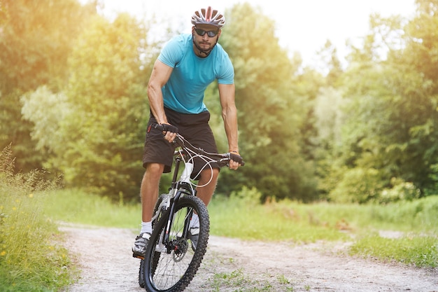 Amateur cyclist on his bike in the forest