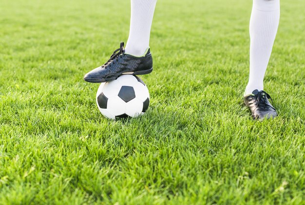 Amateur football concept with man posing with ball