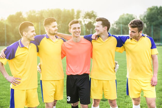 Amateur football concept with team posing