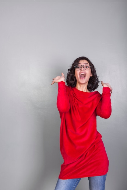 Amazed woman in red clothes 