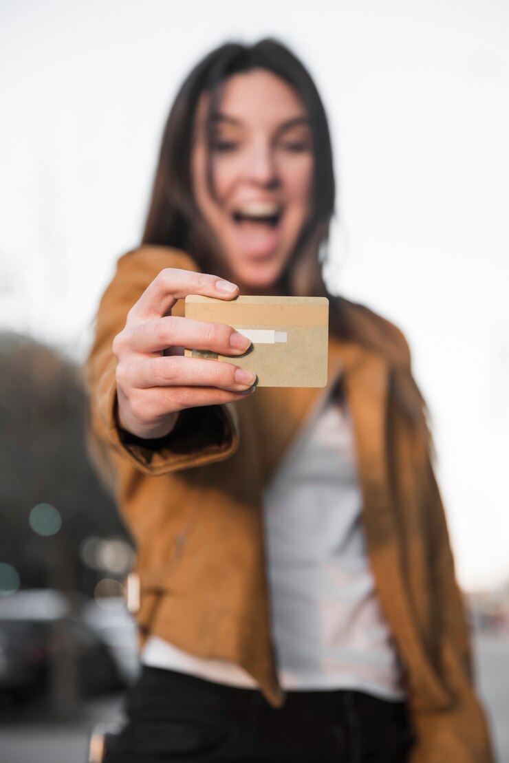 Free Photo amazed young lady with plastic card