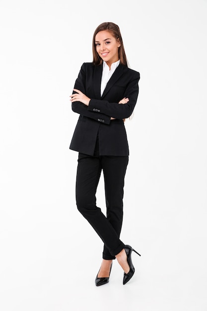 Amazing cheerful business woman standing with arms crossed