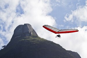 Amazing shot of human flying on a hang glider