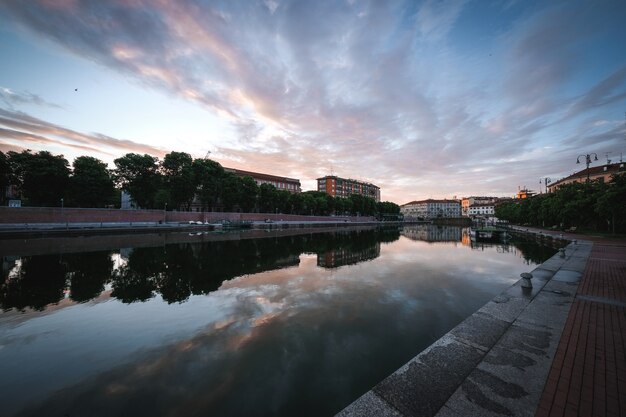 Amazing shot of an old city buildings and a reflective river