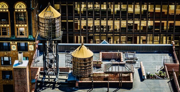 Amazing view of a downtown building roof with a water tank on it