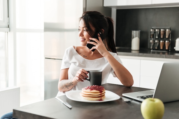 Amazing young lady talking by phone