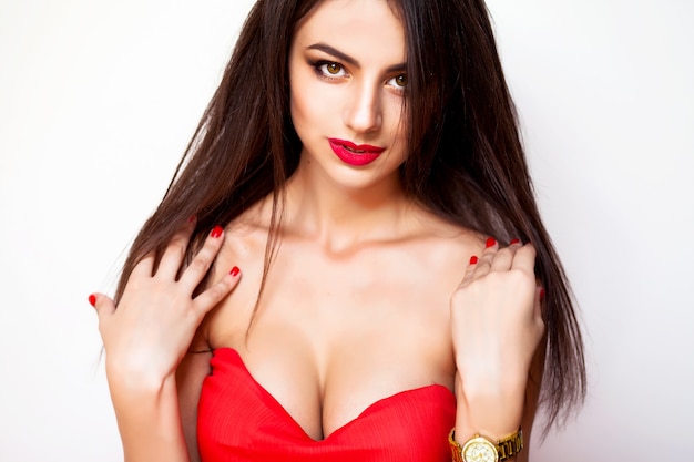 Amazing young woman red dress and makeup