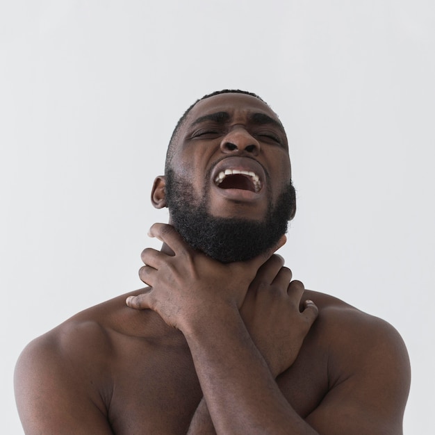 American black person holding hands around his neck