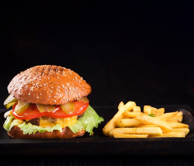 American burger ready to be served with fries