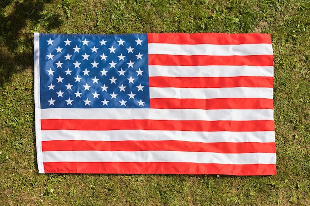 American flag background on grass texture