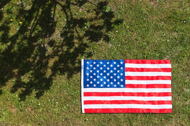 American flag background on grass texture