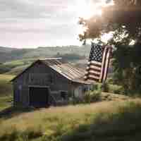 Free photo american flag flying from an old barn in the middle of a meadow