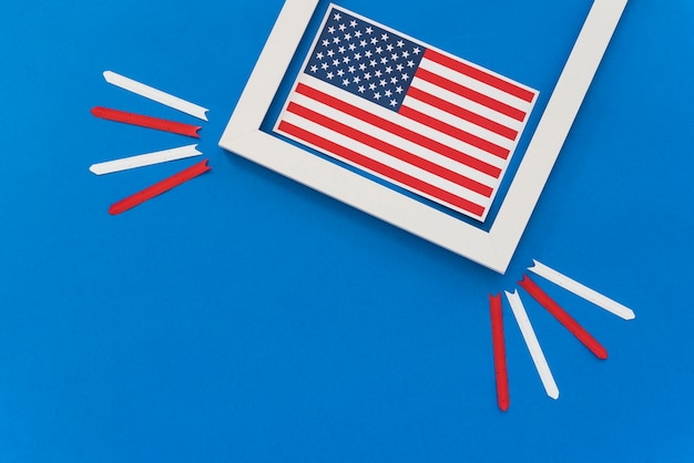 american flag framed on blue surface