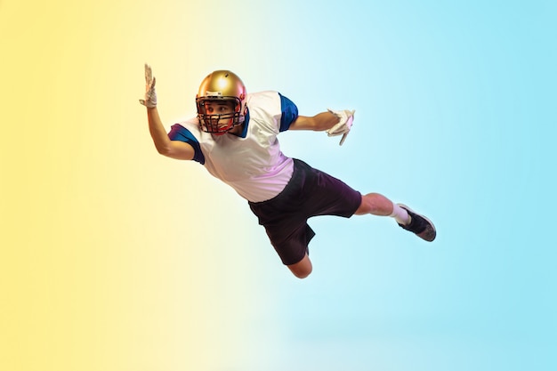 American football player on gradient studio in neon light