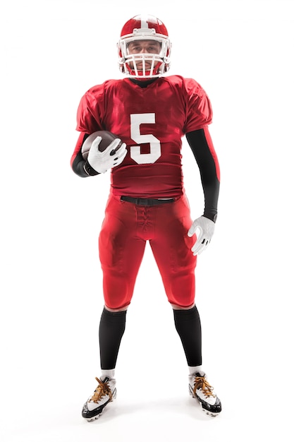 American football player posing with ball on white