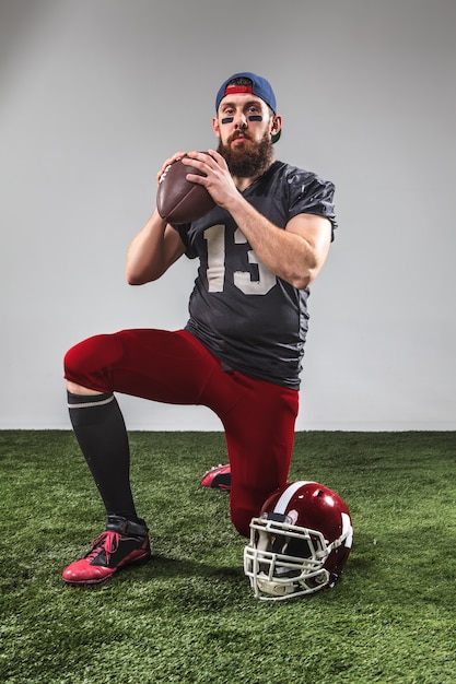 Free photo the american football player with ball