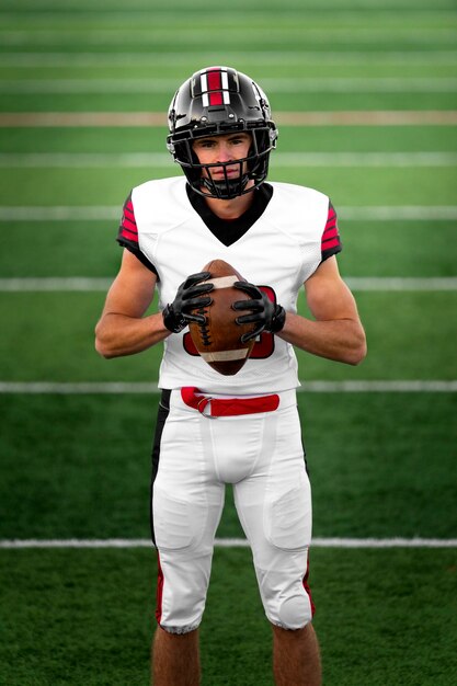 American male football player in uniform on the field