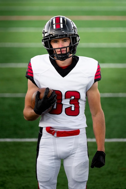 American male football player in uniform on the field