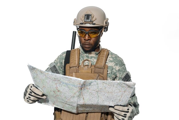 American soldier wearing yellow glasses holding map