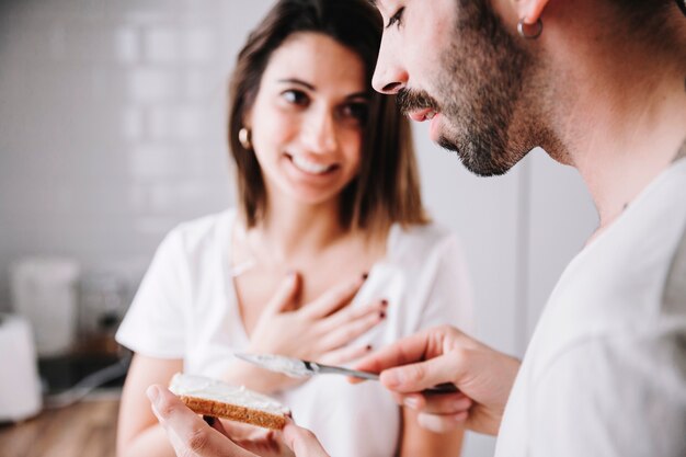 Amorous couple having breakfast