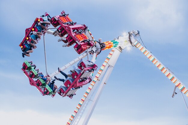 Amusement park with riding attraction full of people