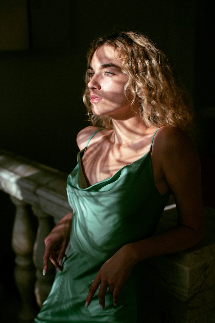 Free Photo analog portrait of beautiful woman posing indoors in an elegant dress